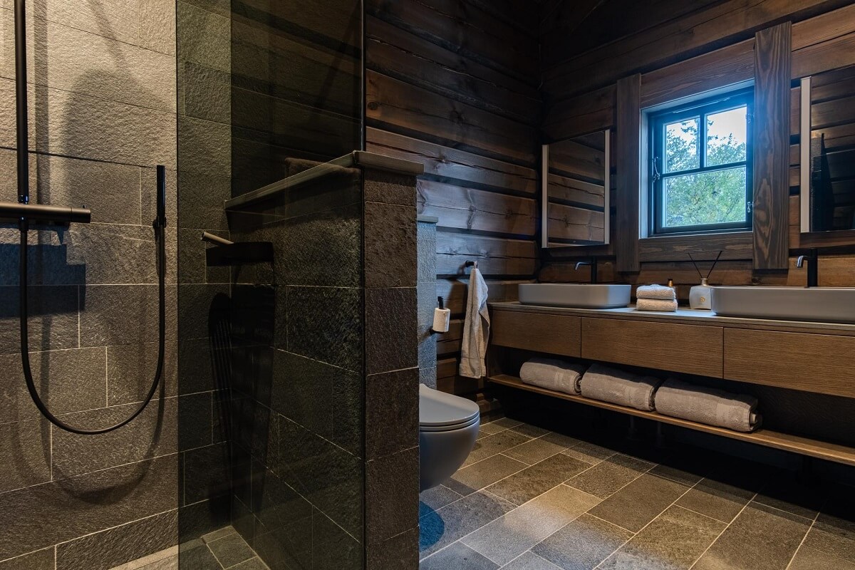 A Modern Rustic Log House in Sweden 12 dark-bathroom-wooden-walls-log-house-sweden-ordroom