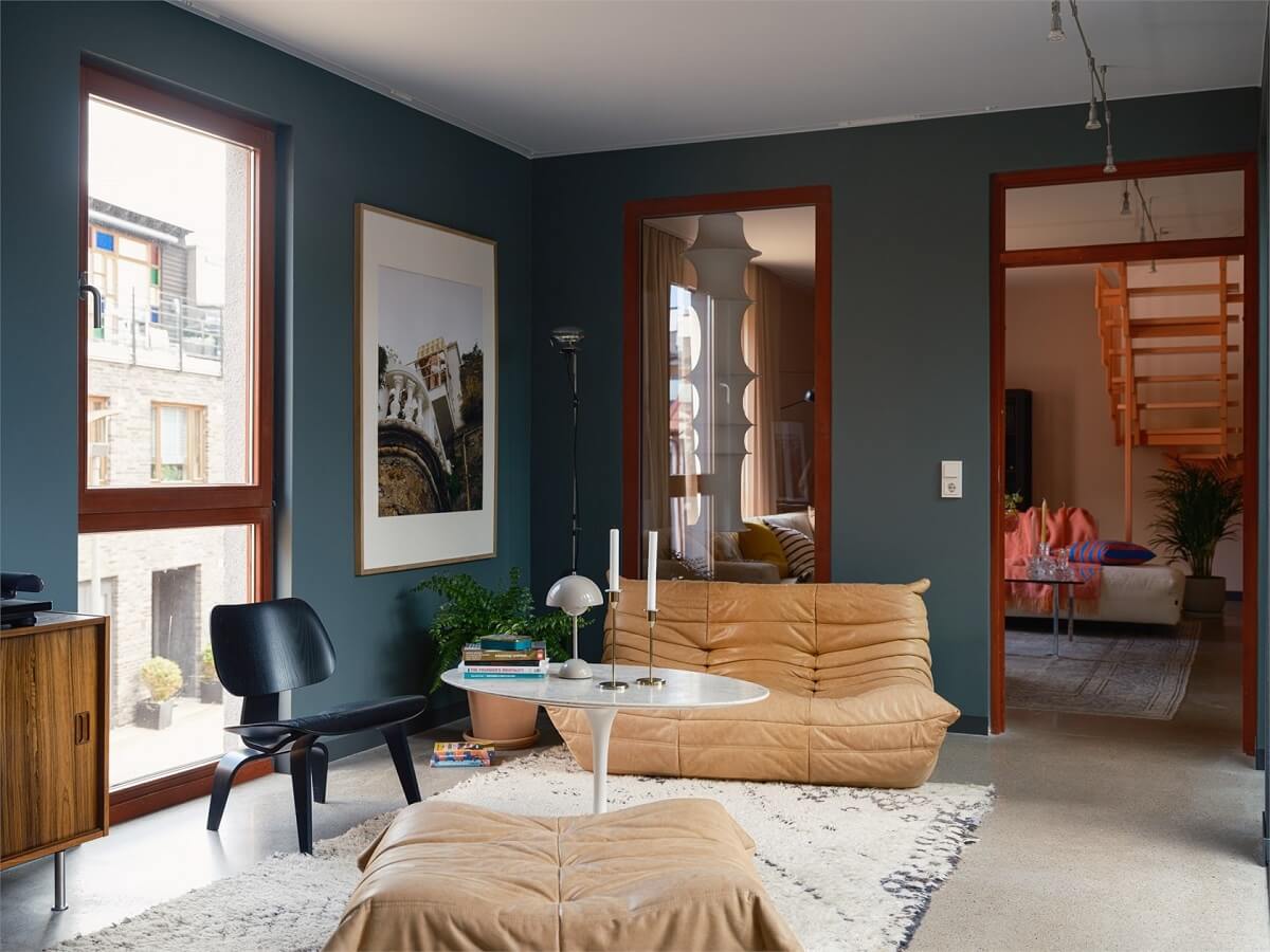 A Colorful Modern Townhouse in Malmö 6 dark-blue-sitting-room-togo-sofa-nordroom