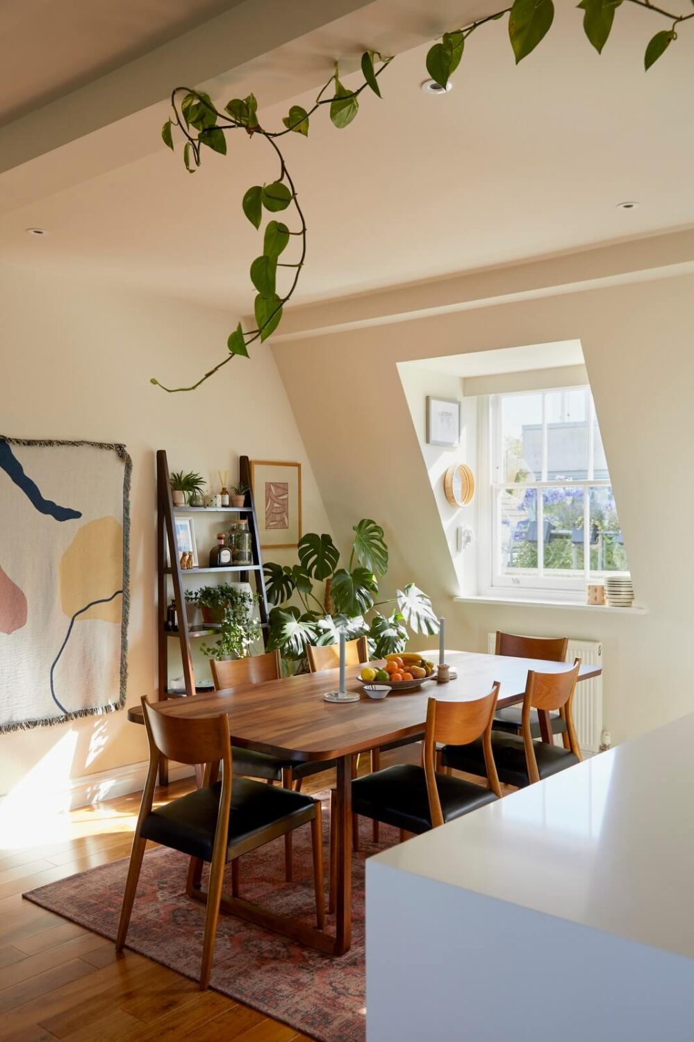 A Light Attic Apartment in London 6 dining-table-open-kitchen-slanted-ceiling-nordroom