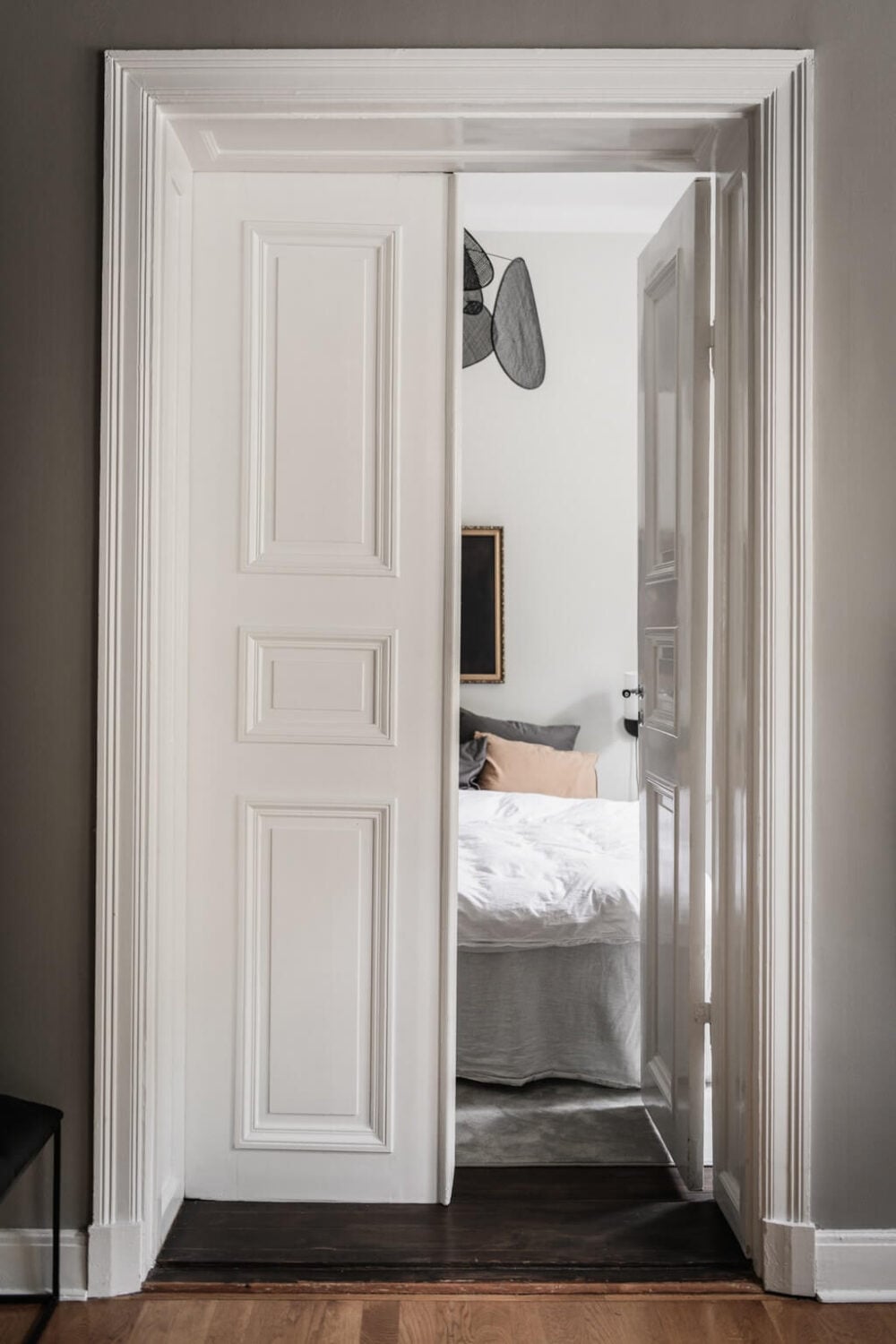 A Dark Gray Painted Ceiling in a Scandi Apartment 11 double-doors-bedroom-gray-scandinavian-apartment-nordroom
