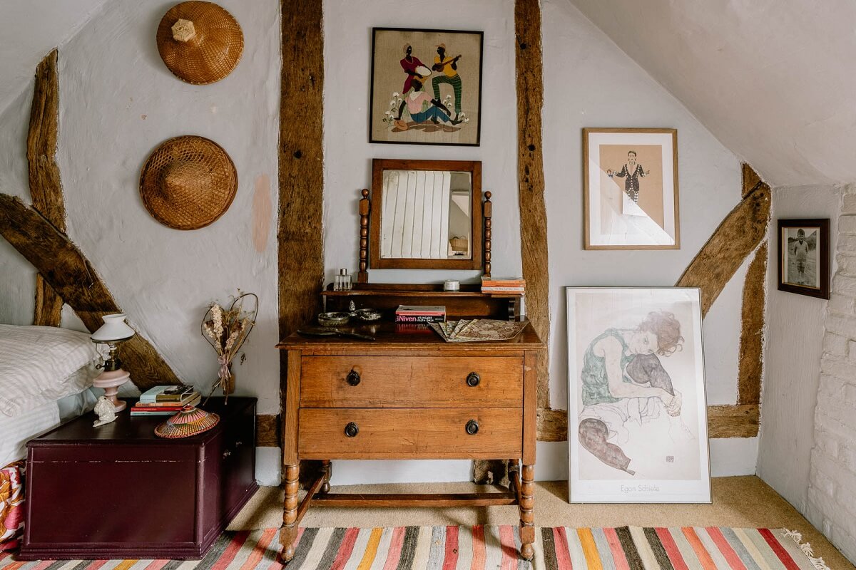 A Charming English Cottage with Color Accents 16 english-cottage-exposed-beams-striped-rug-nordroom
