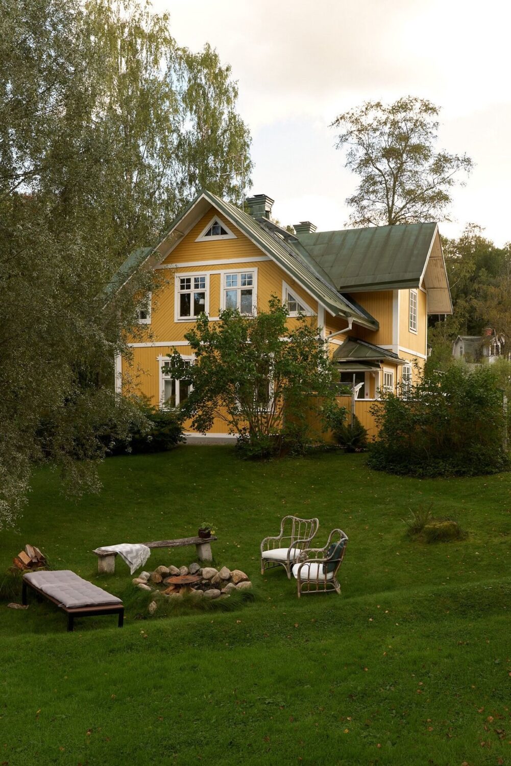 10 Easy Budget-Friendly Upgrades To Boost Your Home's Appeal 19 fire-pit-garden-yellow-swedish-house-nordroom