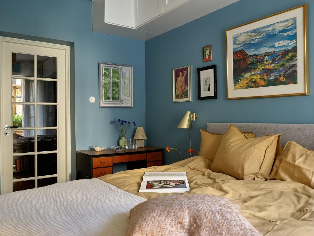 A Scandinavian Apartment with a Fresh Blue Bedroom 17 fresh-blue-wall-color-bedroom-yellow-bedding-nordroom