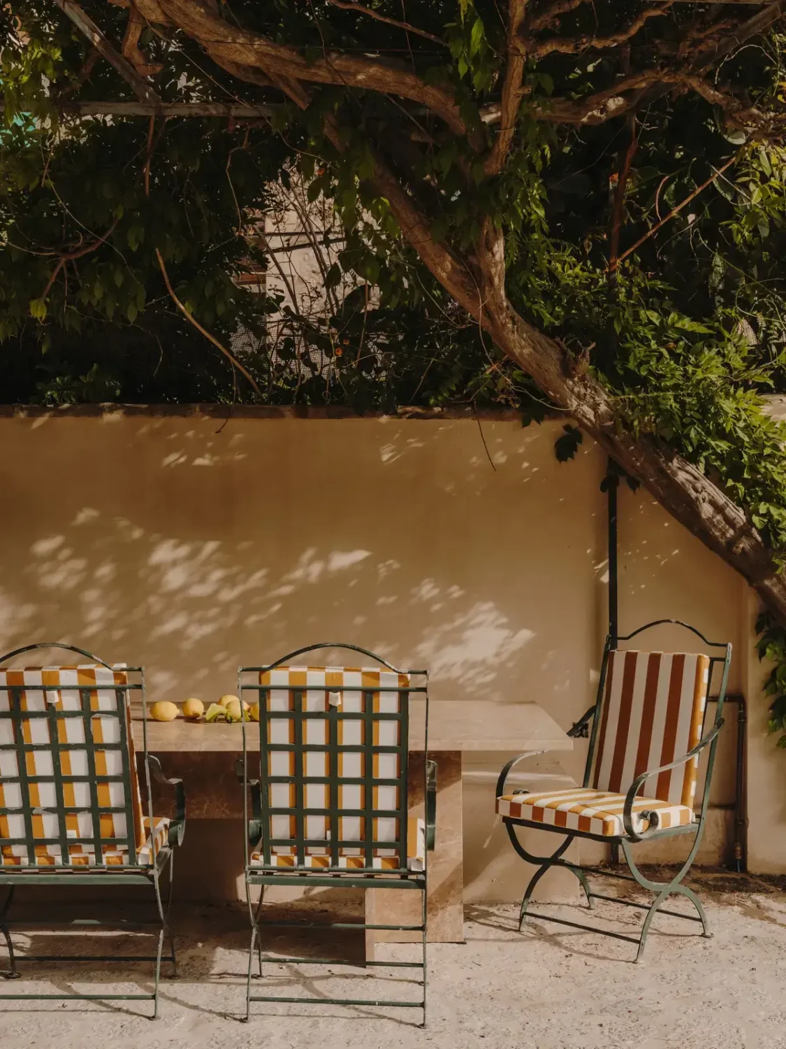 A Historic Townhouse on Majorca with a Striped Pool 34 garden-dining-area-nordroom