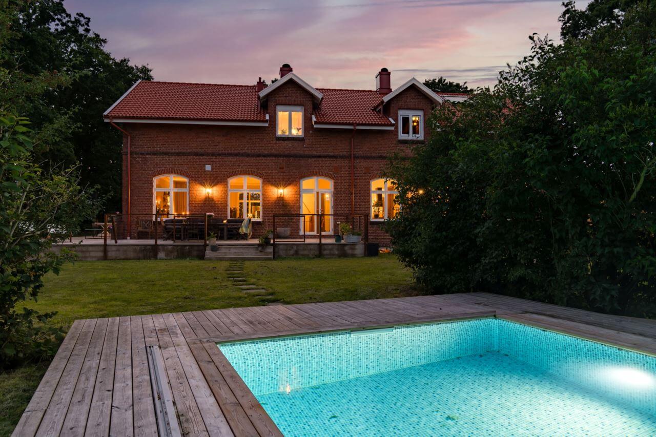 A Former Swedish School is Now a Beautiful Home 29 garden-swimming-pool-at-night-nordroom