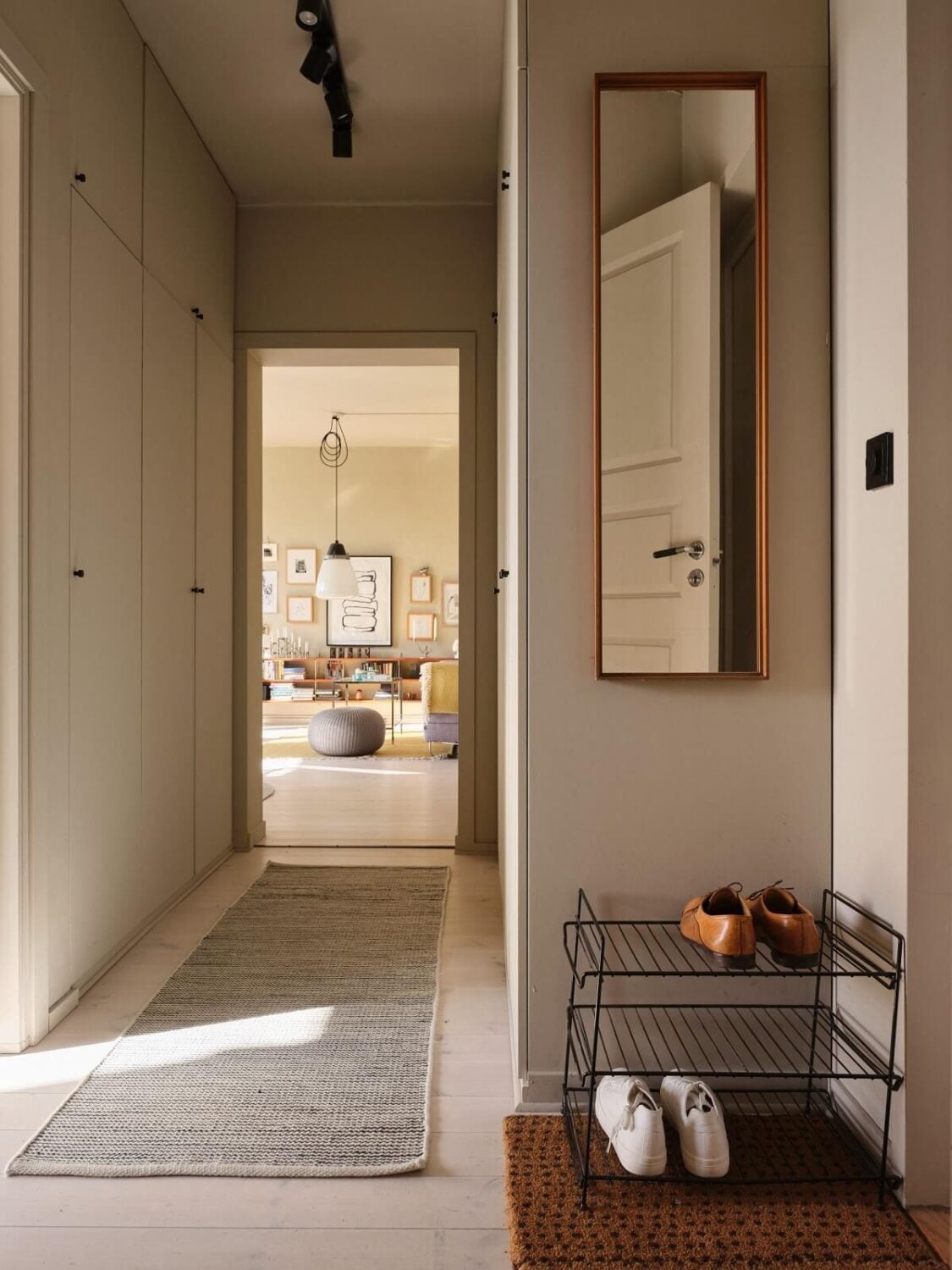 A Serene Beige Apartment with Two Balconies 18 hallway-built-in-closets-nordroom