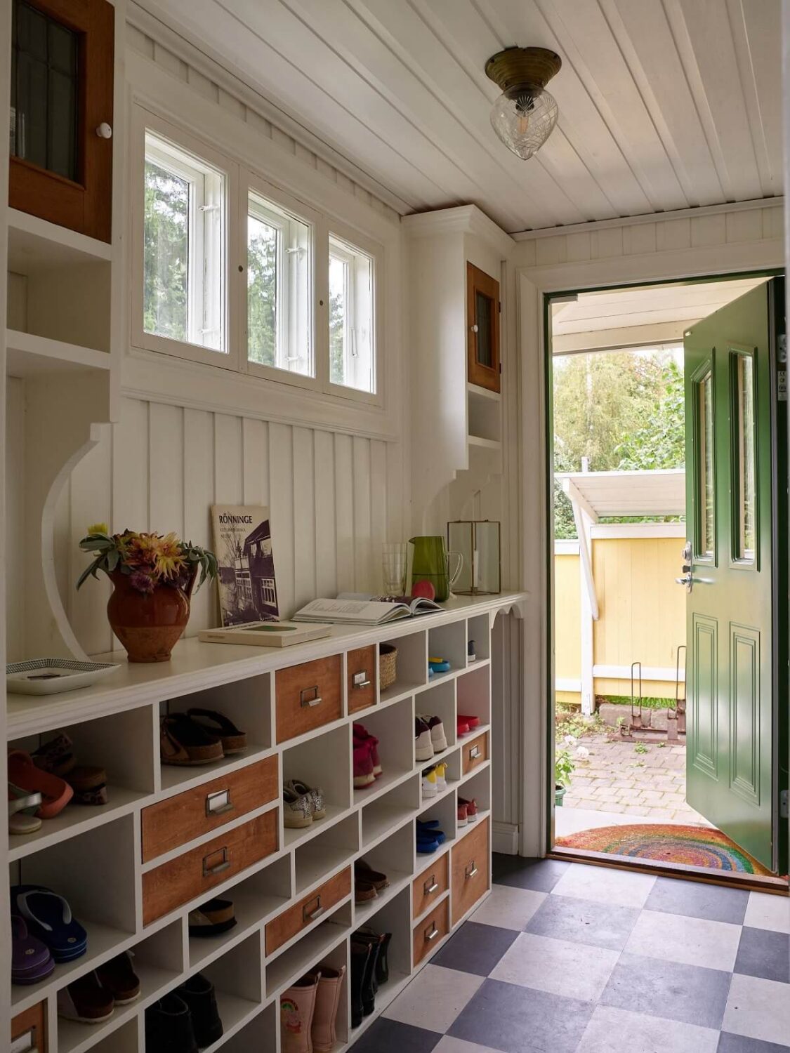 A Beautiful Swedish Country House with a Large Garden 18 hallway-checkerboard-floor-custom-open-shoe-cabinet-nordroom