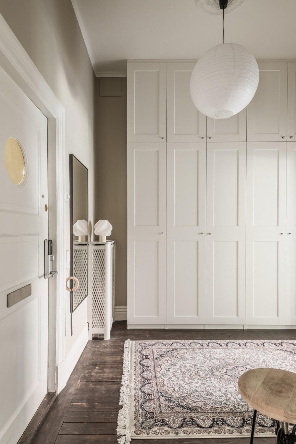 A Dark Gray Painted Ceiling in a Scandi Apartment 23 hallway-warrobes-light-rug-nordroom