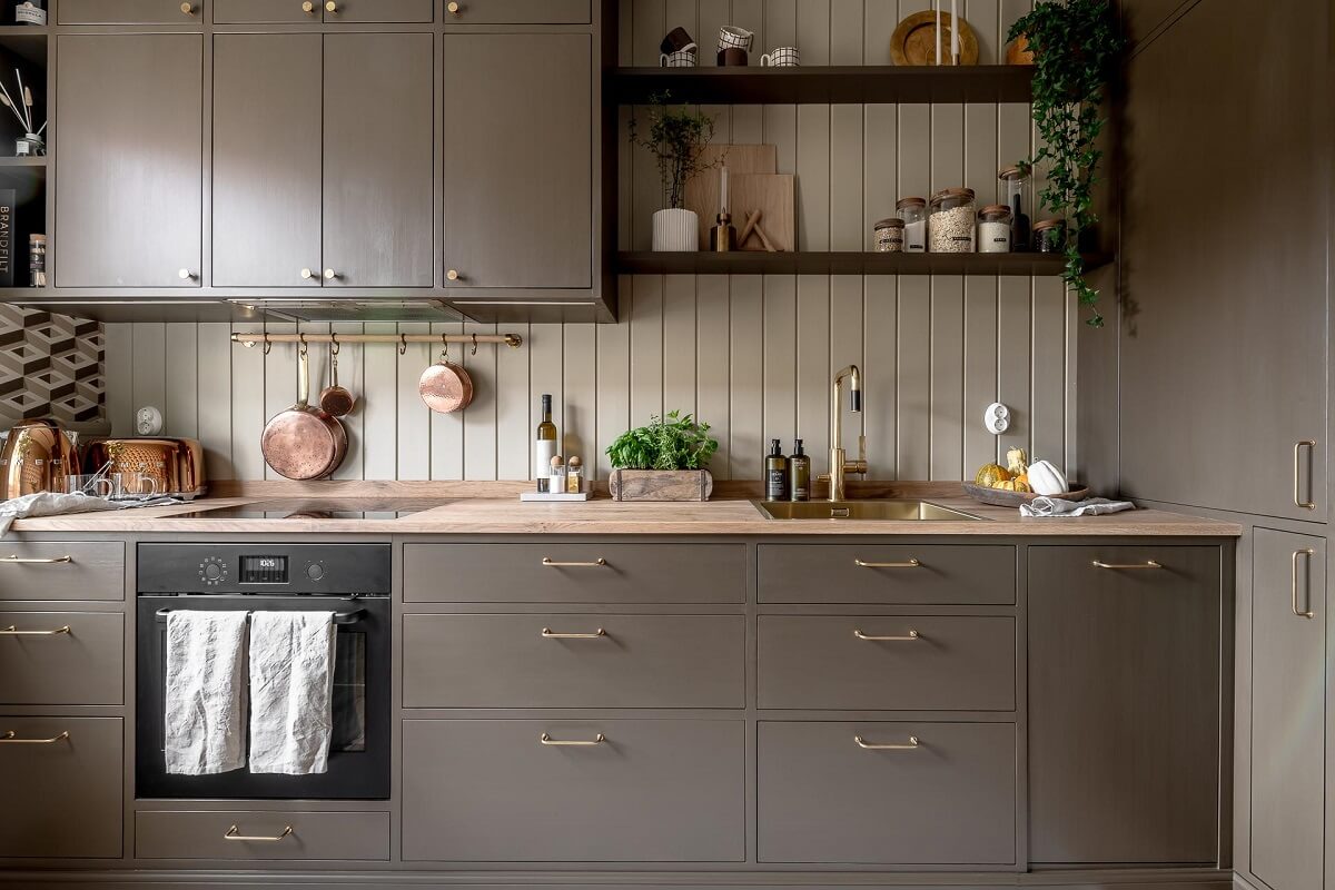 A Serene Studio Apartment with a Brown Kitchen 13 kitchen-brown-cabinets-beige-wall-paneling-nordroom