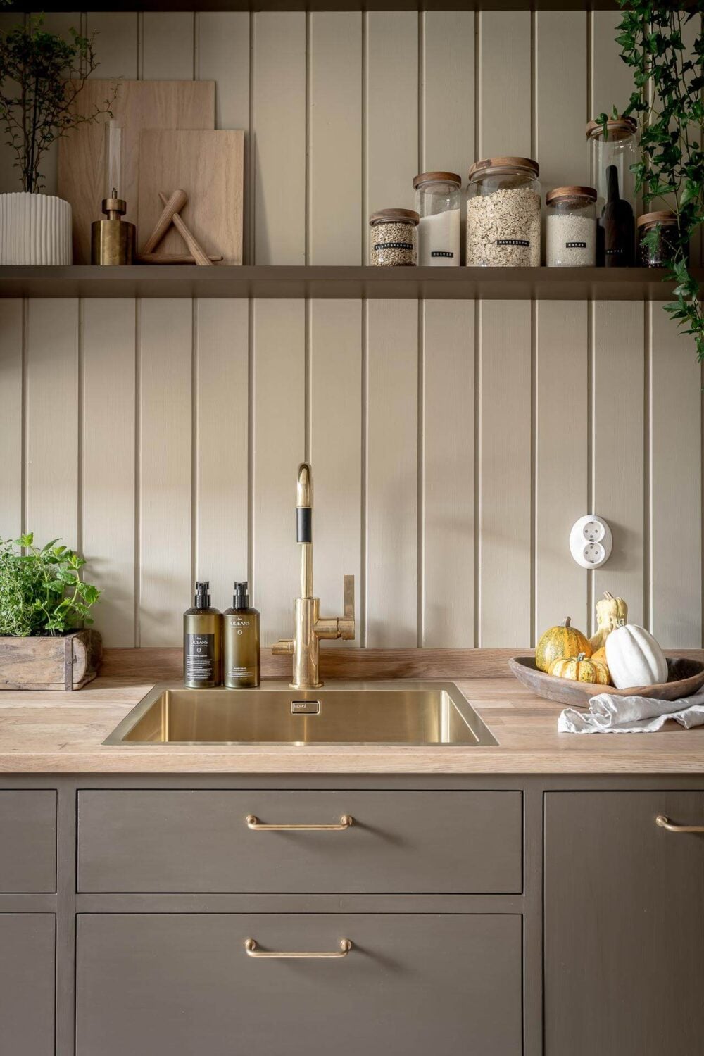 A Serene Studio Apartment with a Brown Kitchen 14 kitchen-detail-brown-cabinets-open-shelf-nordroom