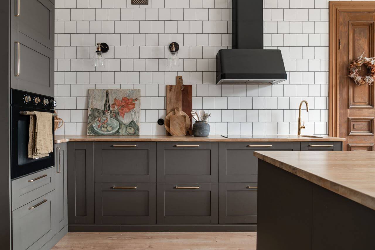 A Former Swedish School is Now a Beautiful Home 5 kitchen-gray-cabinets-tiled-wall-nordroom