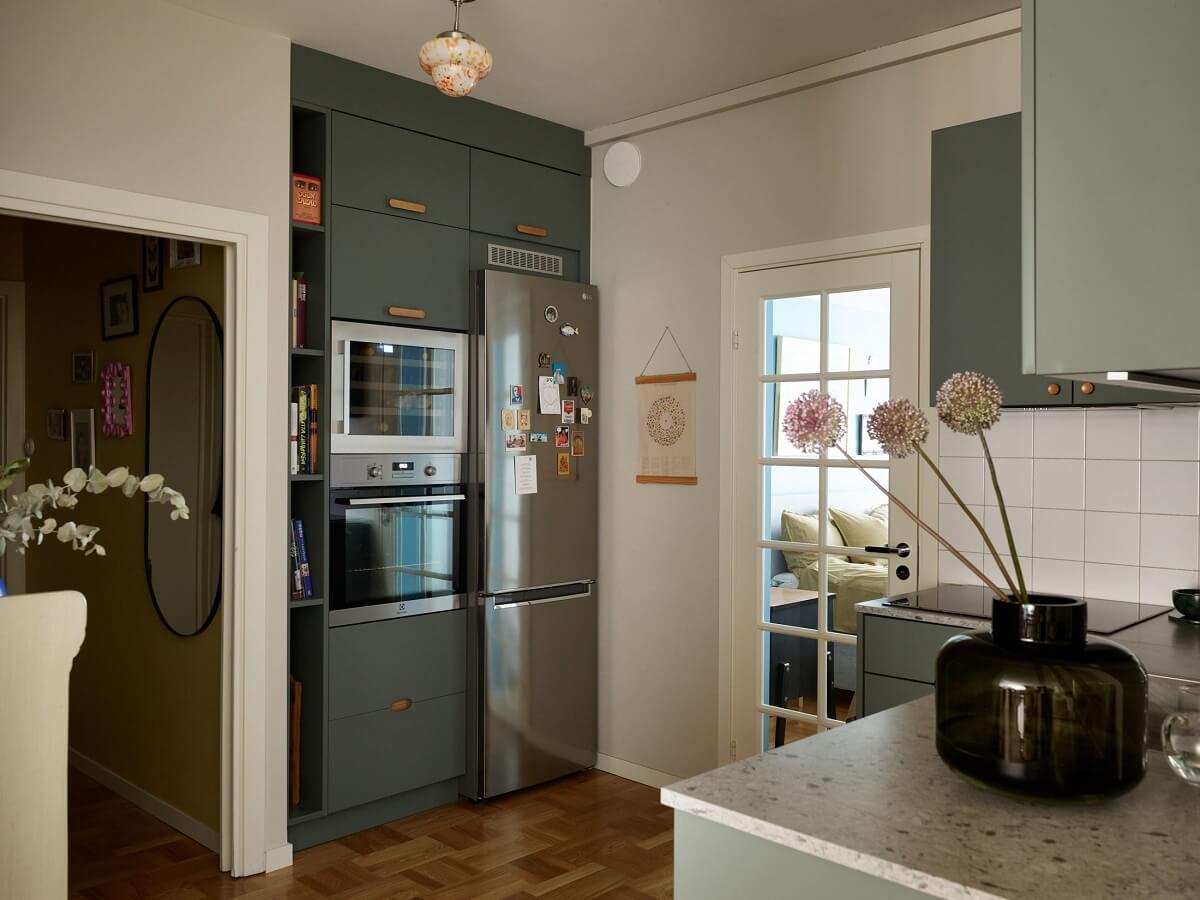 A Scandinavian Apartment with a Fresh Blue Bedroom 13 kitchen-green-cabinets-nordroom