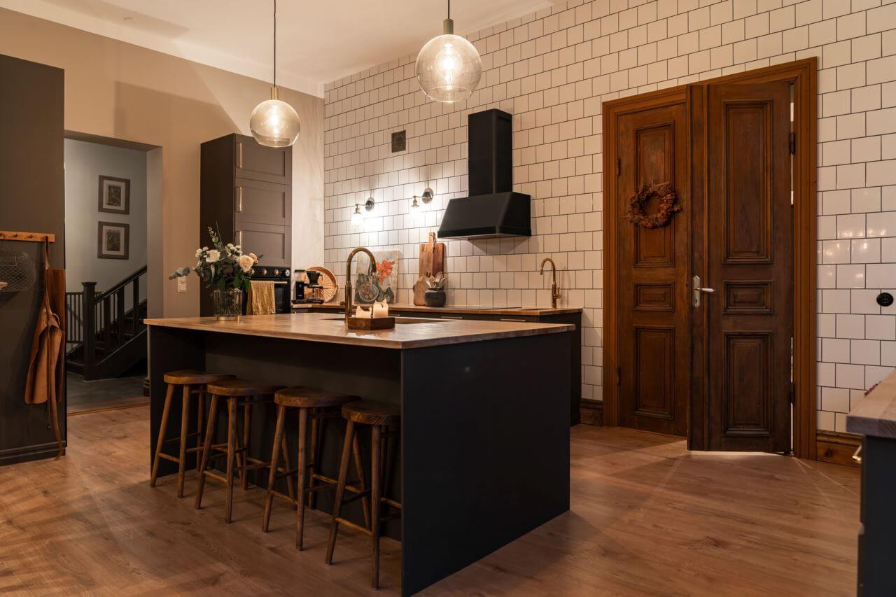 A Former Swedish School is Now a Beautiful Home 6 kitchen-island-floor-to-ceiling-tiled-wall-nordroom