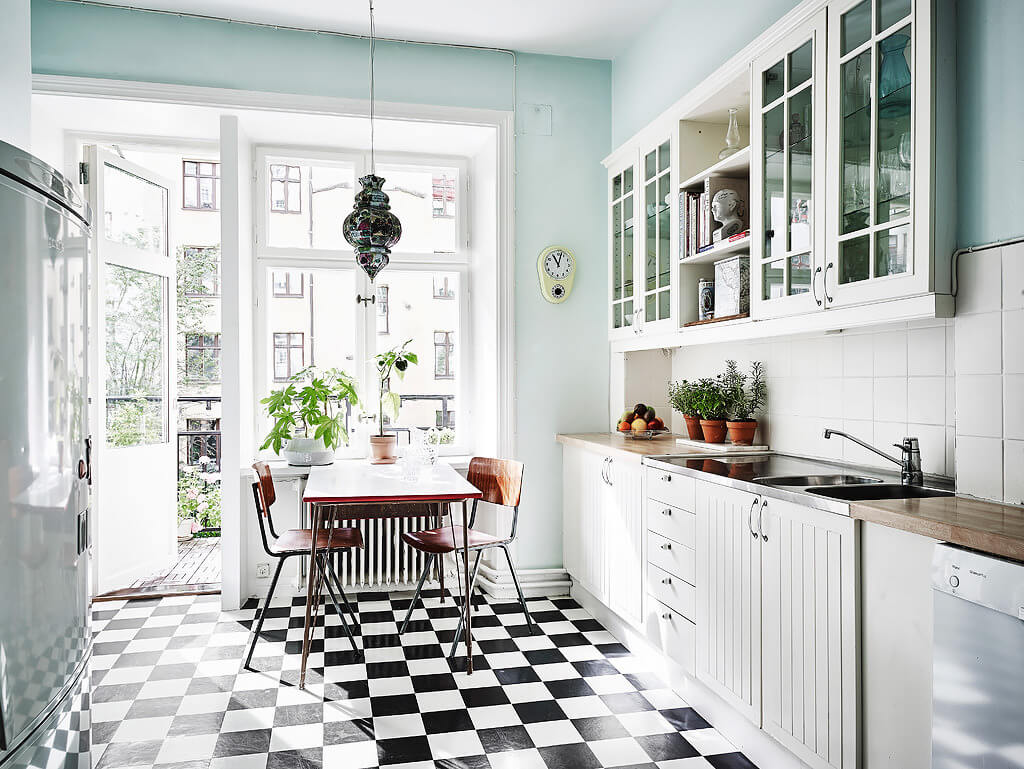 Sherwin-Williams Color of the Year 2024: Upward 25 kitchen-light-blue-walls-white-cabinets-checkerboard-floor-nordroom