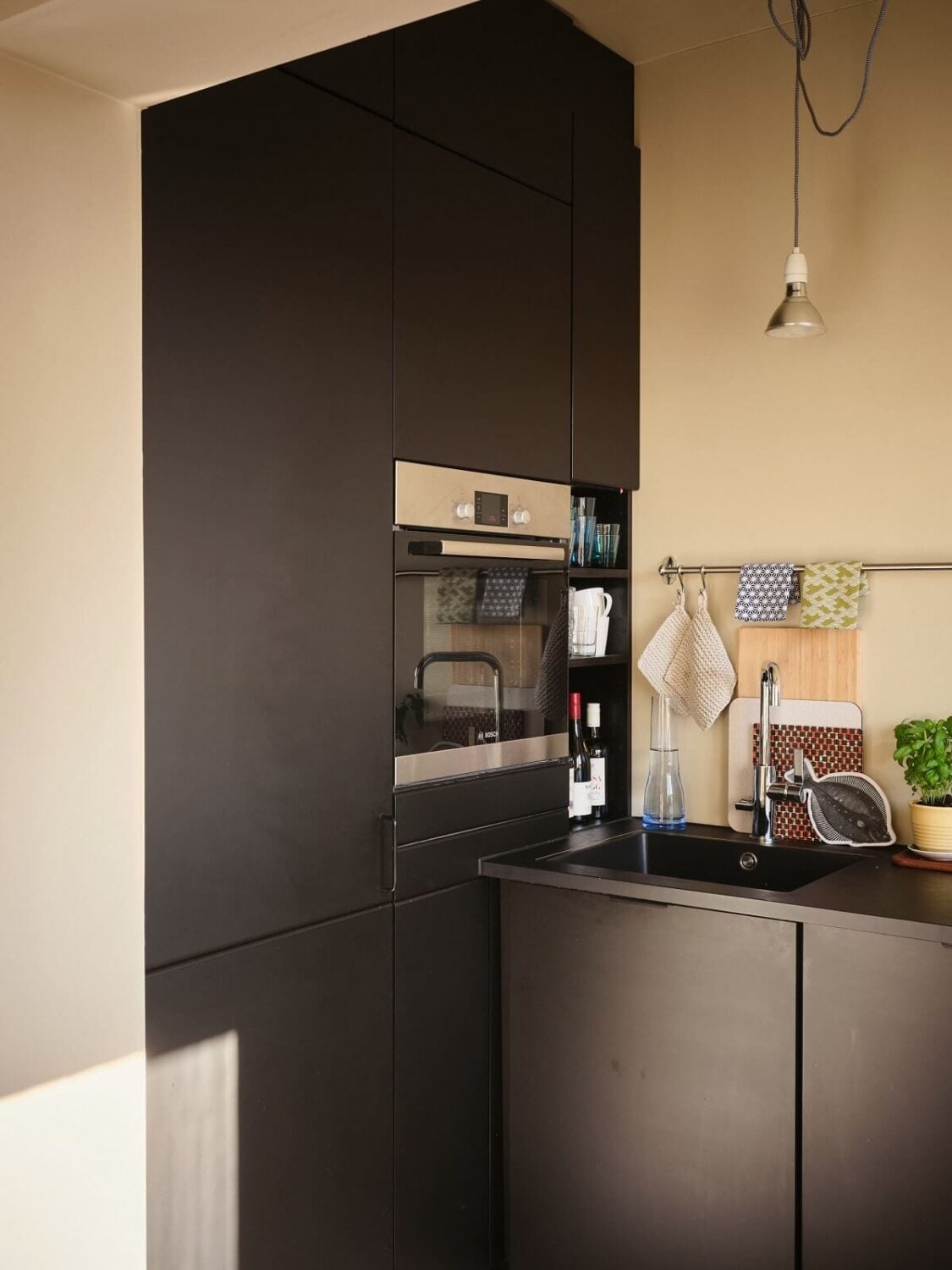 A Serene Beige Apartment with Two Balconies 10 kitchen-modern-black-cabinets-nordroom