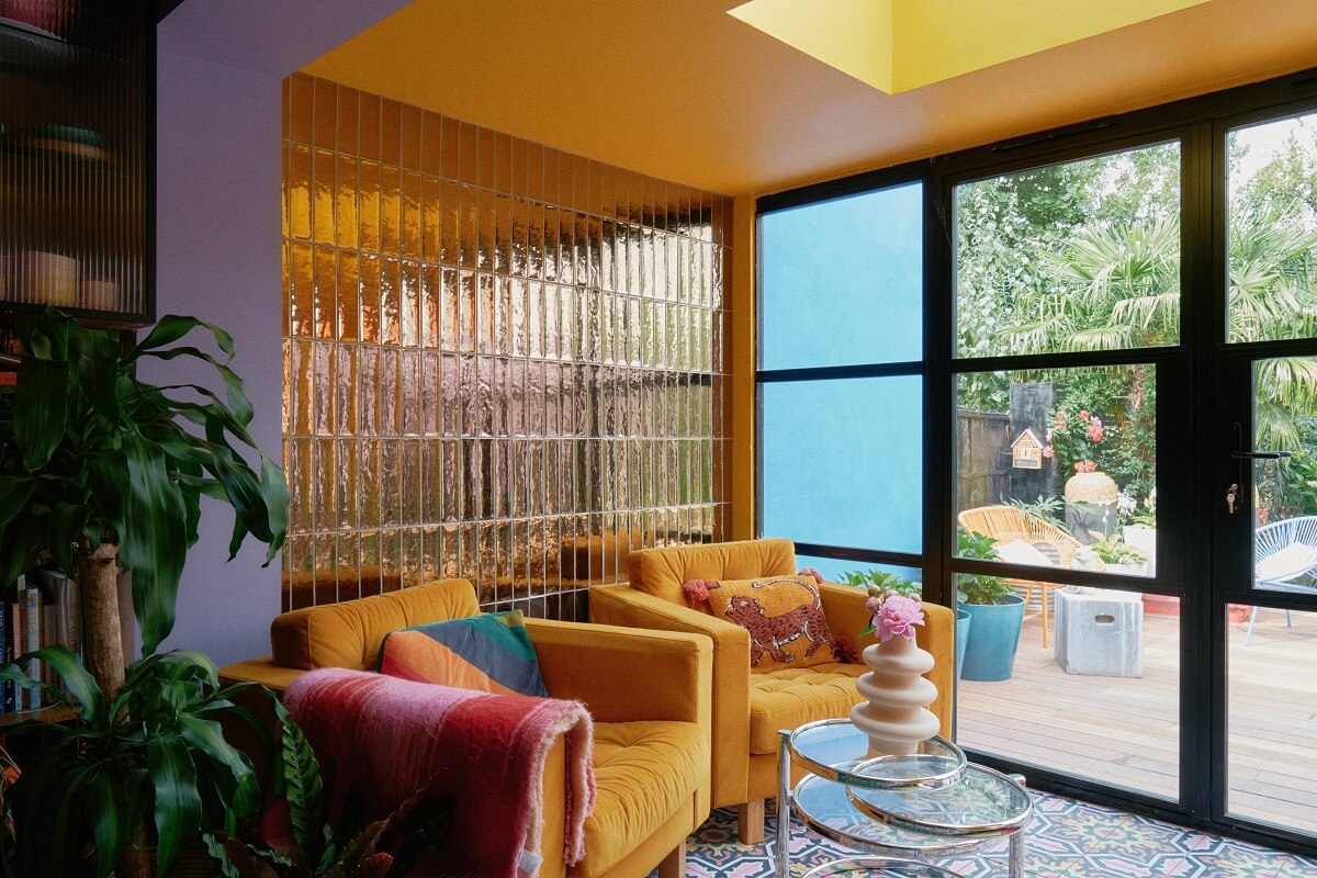A Fun Colorful Family House in England 17 kitchen-seating-area-ochre-yellow-chairs-glossy-tiles-nordroom