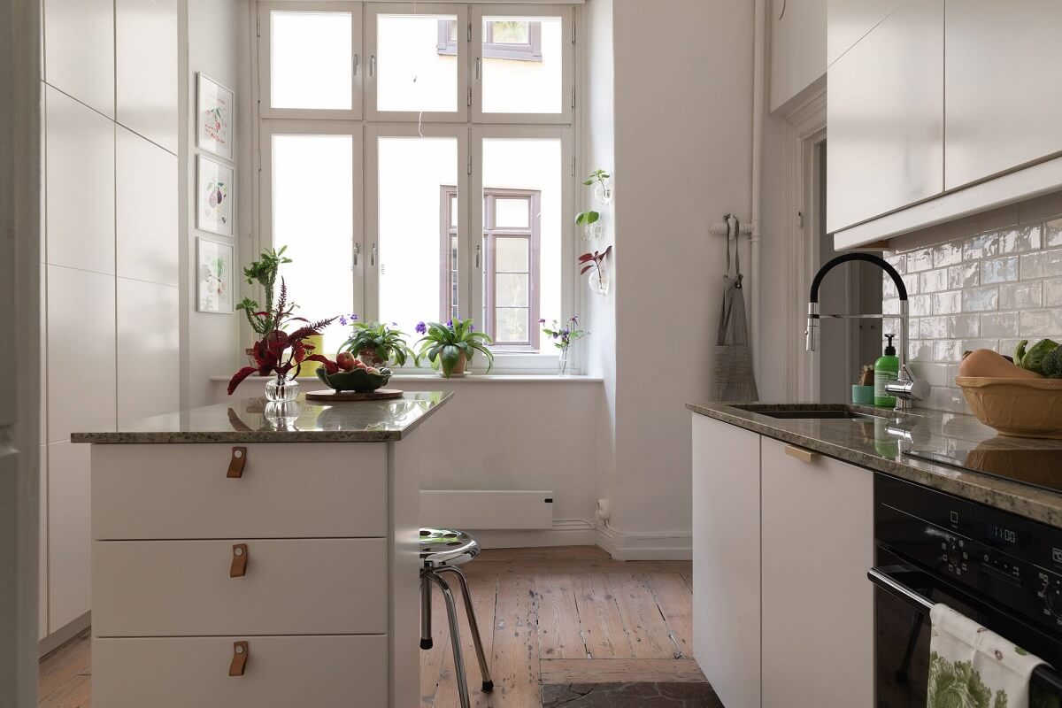 A Lovely Swedish House Revisited 11 kitchen-white-cabinets-small-island-nordroom
