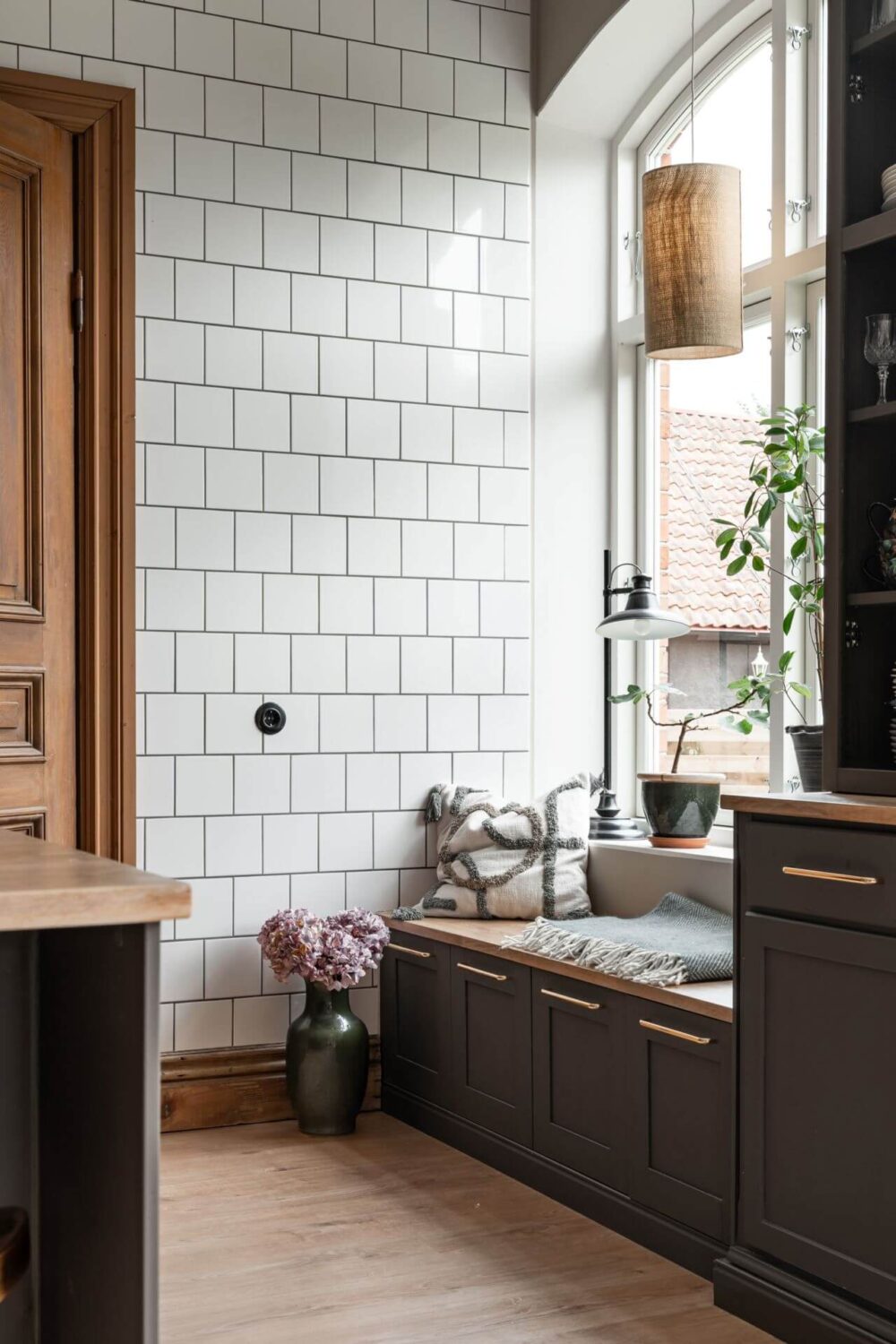 A Former Swedish School is Now a Beautiful Home 3 kitchen-window-seat-tiled-wall-nordroom