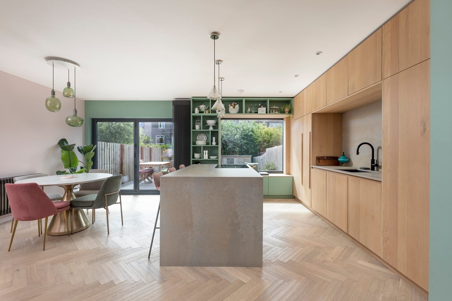 An Open-Plan Living and Kitchen in Green and Pink Tones 4 kitchen