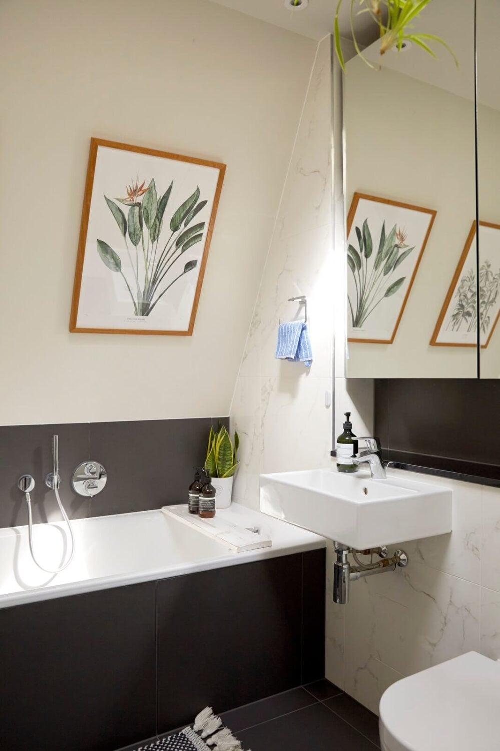A Light Attic Apartment in London 15 light-bathroom-dark-gray-tiles-nordroom