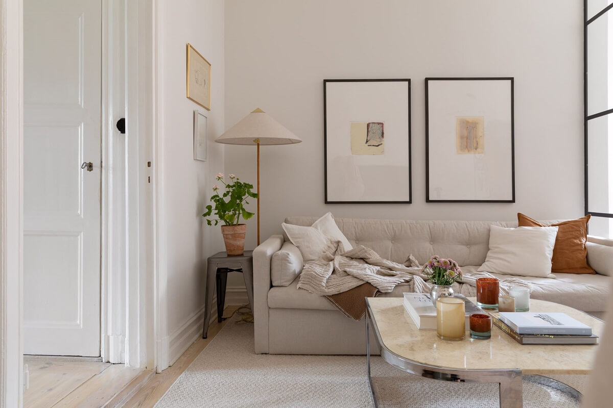A Light Swedish Apartment with an Industrial Glass Wall 3 light-colored-living-room-nordroom