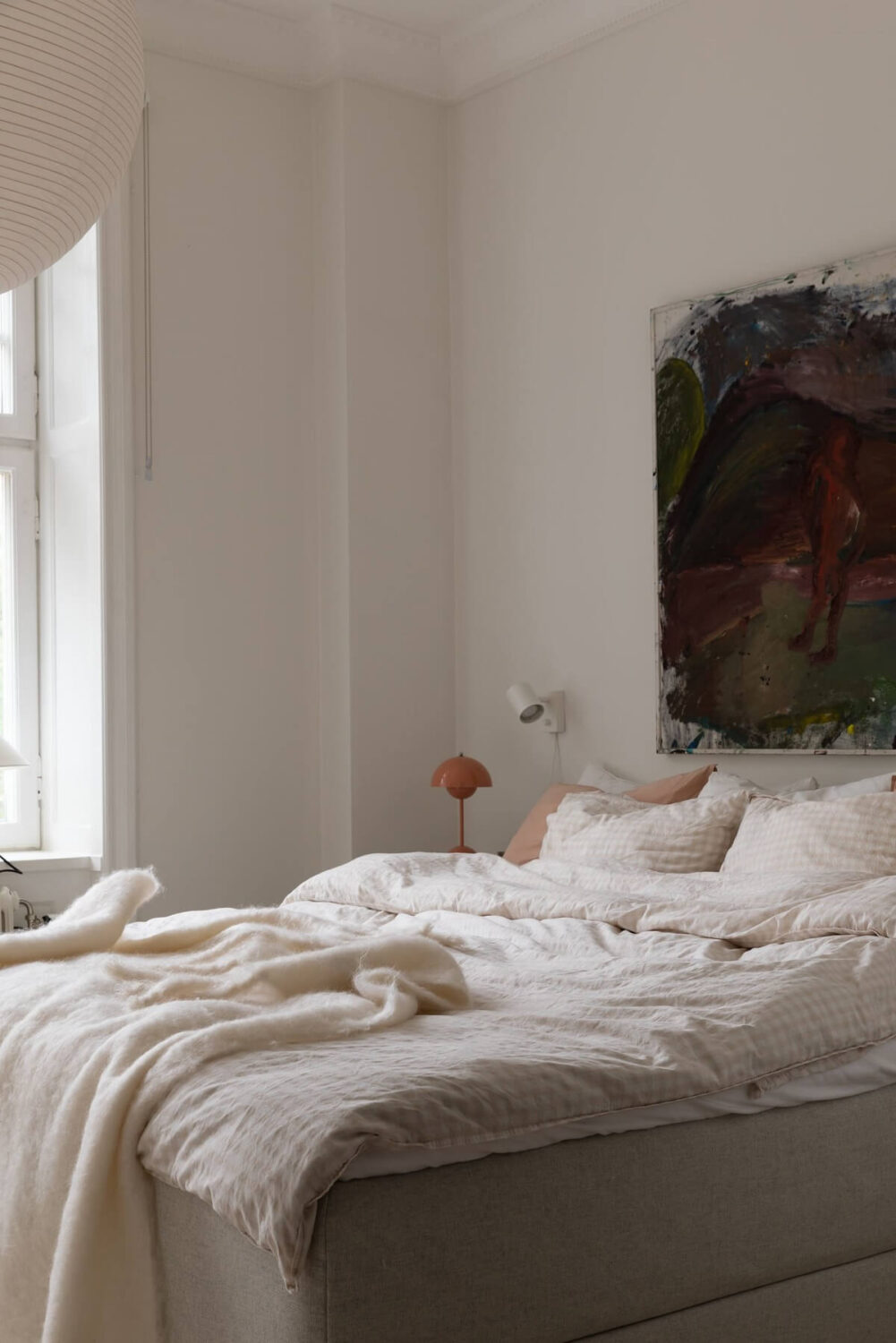 A Light Swedish Apartment with an Industrial Glass Wall 21 light-master-bedroom-artwork-nordroom