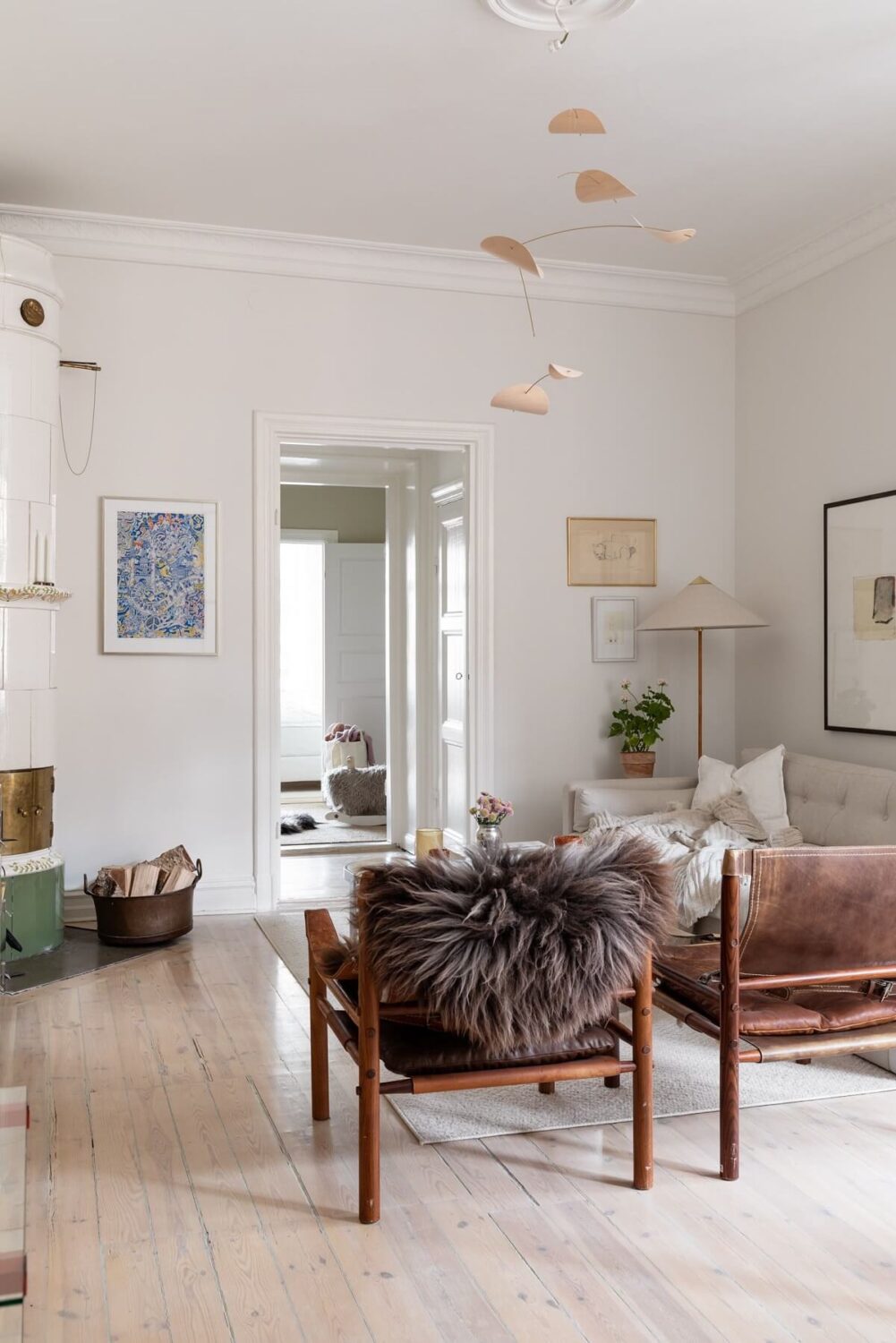 A Light Swedish Apartment with an Industrial Glass Wall 8 light-scandinavian-living-room-nordroom