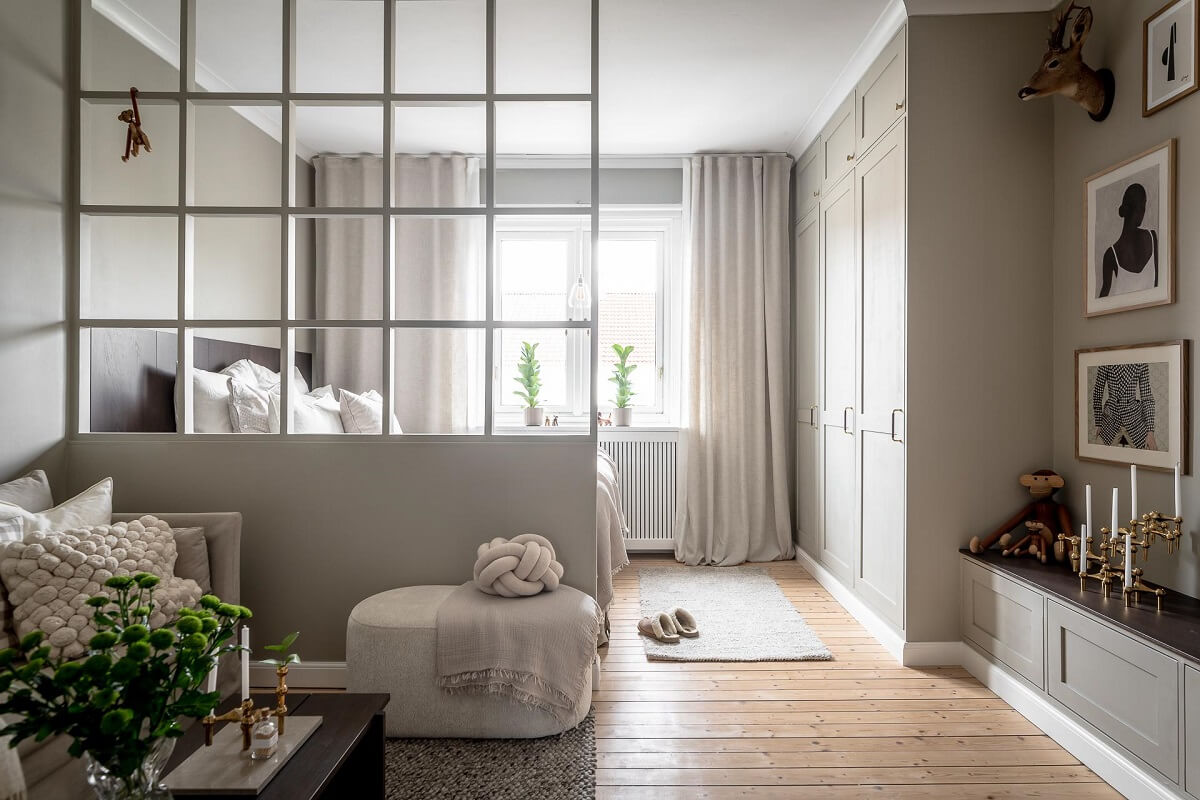 A Serene Studio Apartment with a Brown Kitchen 6 light-scandinavian-studio-apartment-room-divider-nordroom
