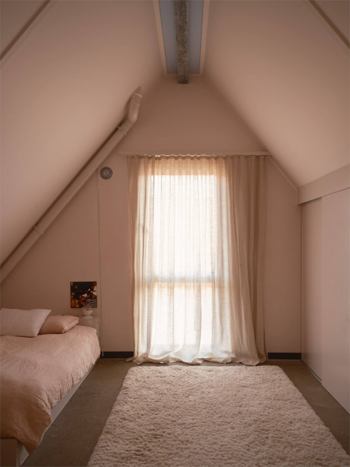 A Colorful Modern Townhouse in Malmö 13 light-serene-bedroom-pitched-roof-nordroom