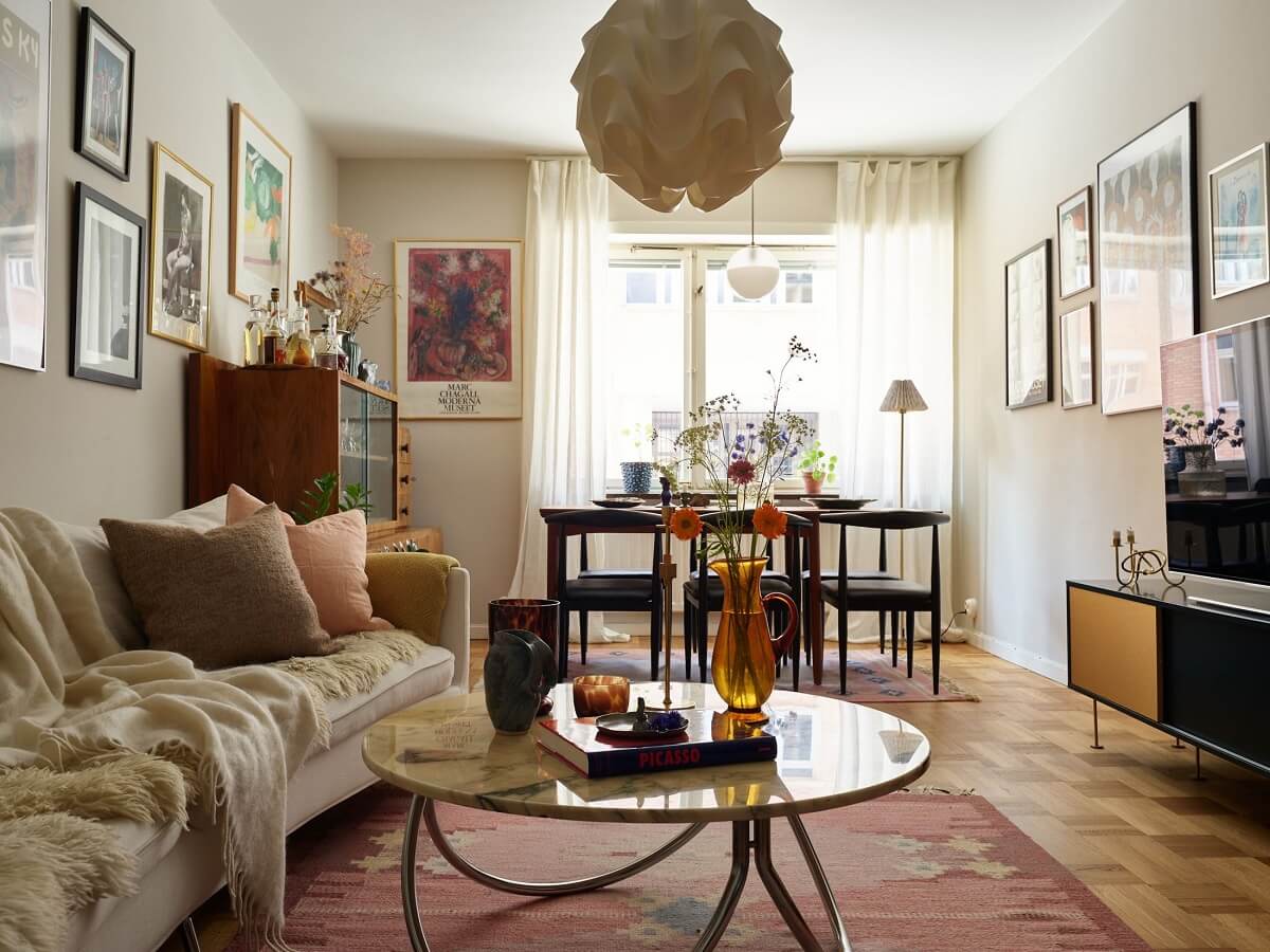 A Scandinavian Apartment with a Fresh Blue Bedroom 2 living-room-beige-walls-wooden-floor-pink-rug-nordroom