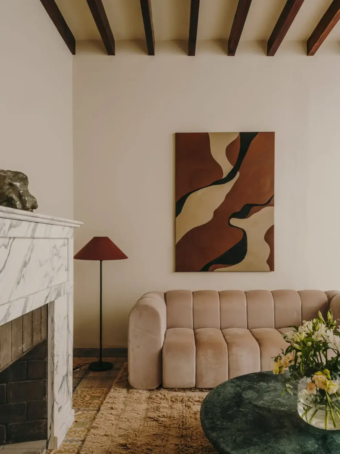 A Historic Townhouse on Majorca with a Striped Pool 9 living-room-earth-colored-art-marble-fireplace-nordroom