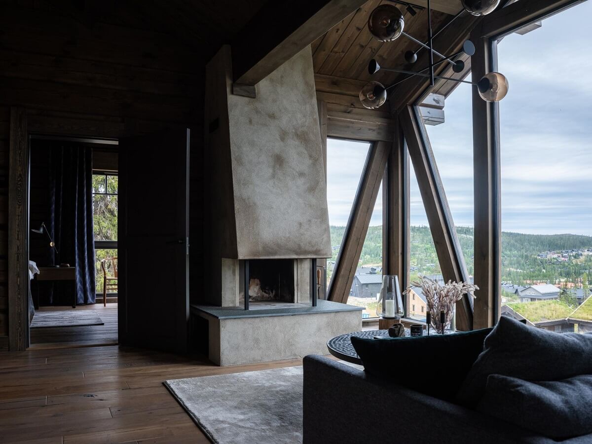 A Modern Rustic Log House in Sweden 3 living-room-fireplace-floor-to-ceiling-windows-log-house-nordroom