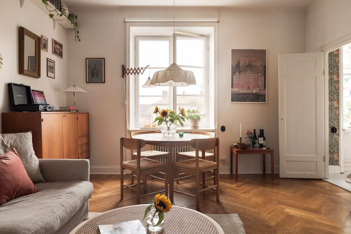 A Lovely Swedish Apartment with William Morris Bedroom 2 living-room-round-dining-table-wooden-floor-norroom