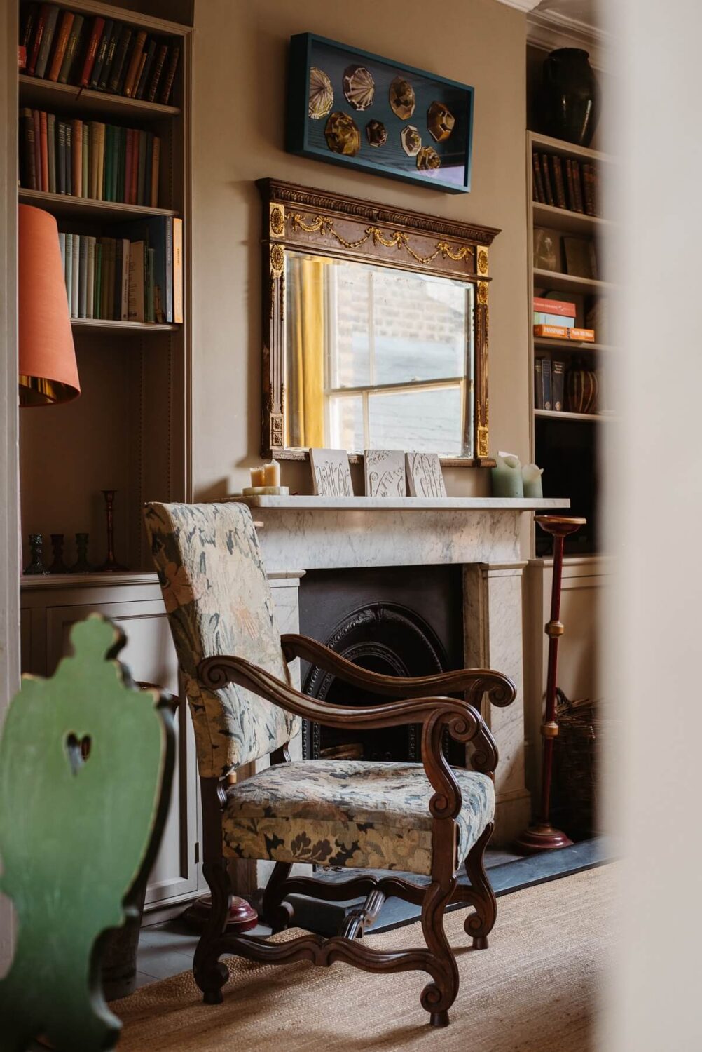 A Cozy Victorian House with Warm Color Accents 2 living-room-view-antique-chair-nordroom