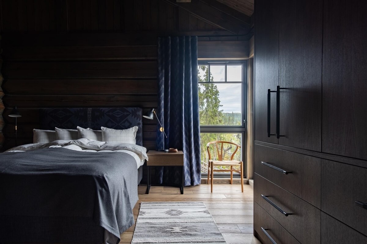 A Modern Rustic Log House in Sweden 11 moody-bedroom-log-house-sweden-nordroom