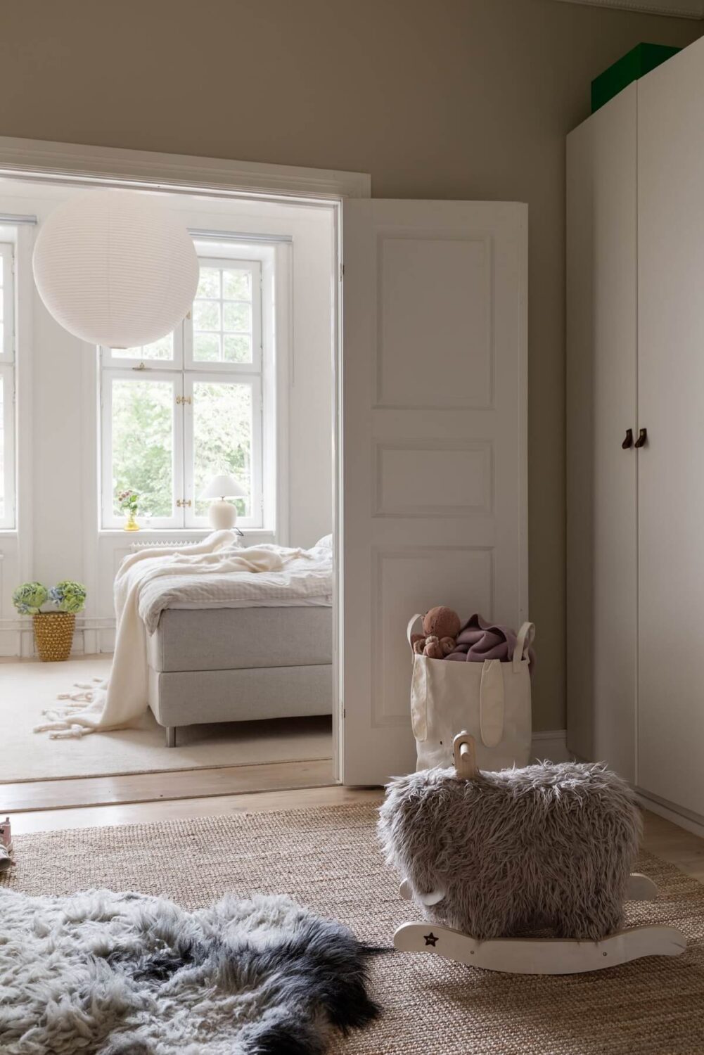 A Light Swedish Apartment with an Industrial Glass Wall 16 nursery-with-wardrobes-master-bedroom