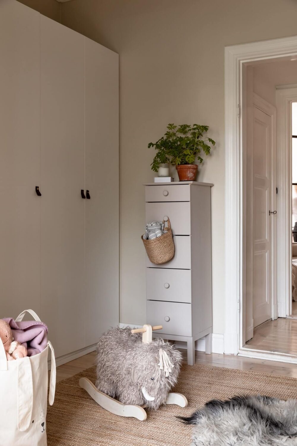 A Light Swedish Apartment with an Industrial Glass Wall 14 nursery-with-wardrobes-nordroom