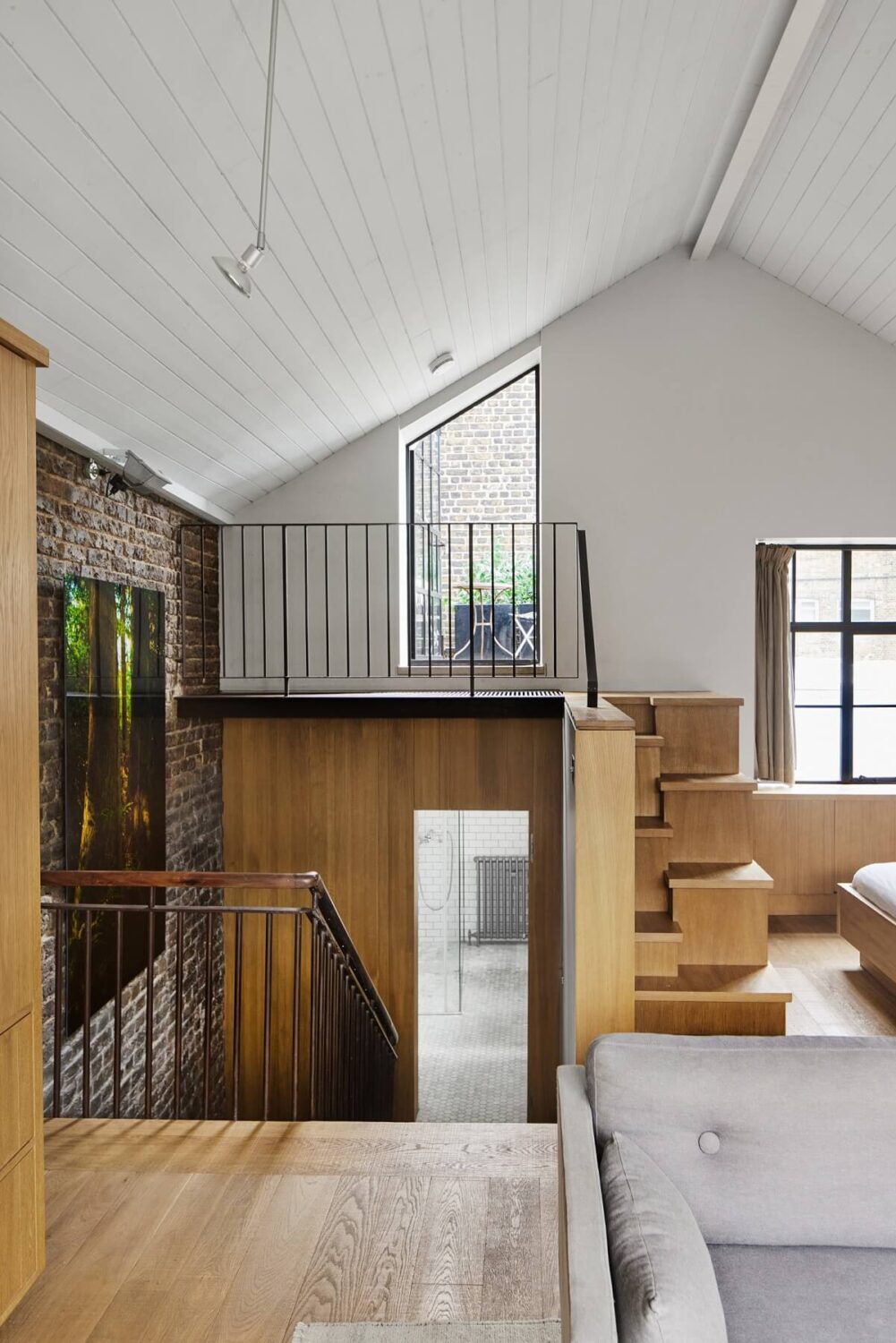 A Modern London Home with Custom Built Oak Furniture 20 open-plan-bedroom-pitched-ceiling-nordroom
