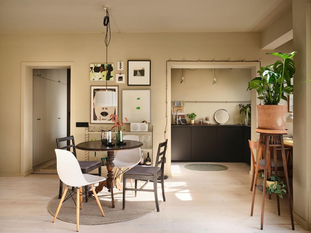 A Serene Beige Apartment with Two Balconies 9 open-plan-living-kitchen-round-dining-table-nordroom