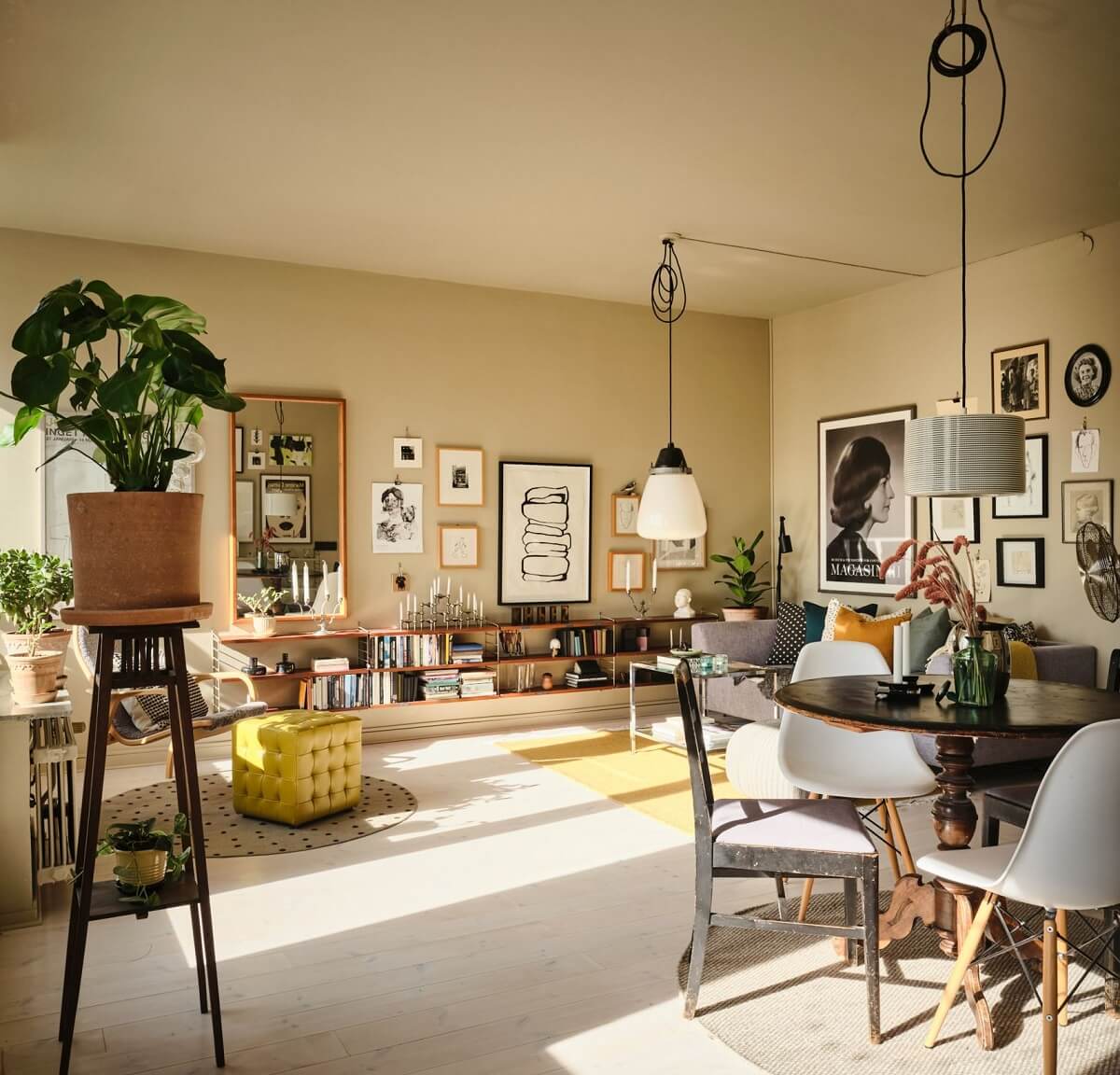 A Serene Beige Apartment with Two Balconies 1 open-plan-living-room-beige-walls-wooden-shelves-round-dining-table-nordroom
