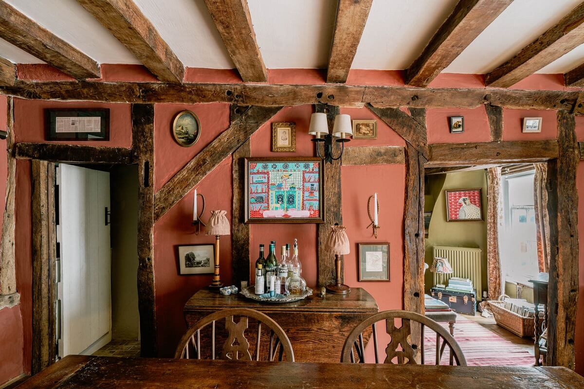 A Charming English Cottage with Color Accents 4 pink-dining-room-farrow-ball-exposed-beams-nordroom