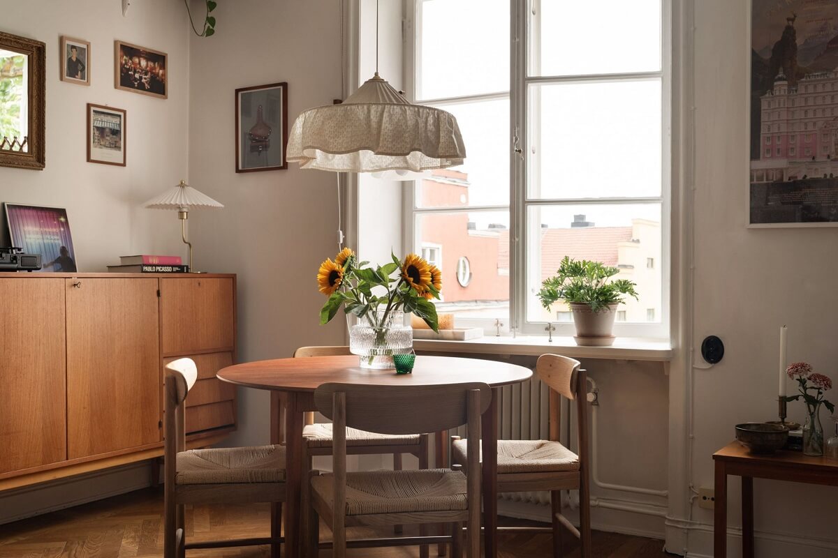 A Lovely Swedish Apartment with William Morris Bedroom 3 round-wooden-dining-table-frilly-lampshade-nordroom