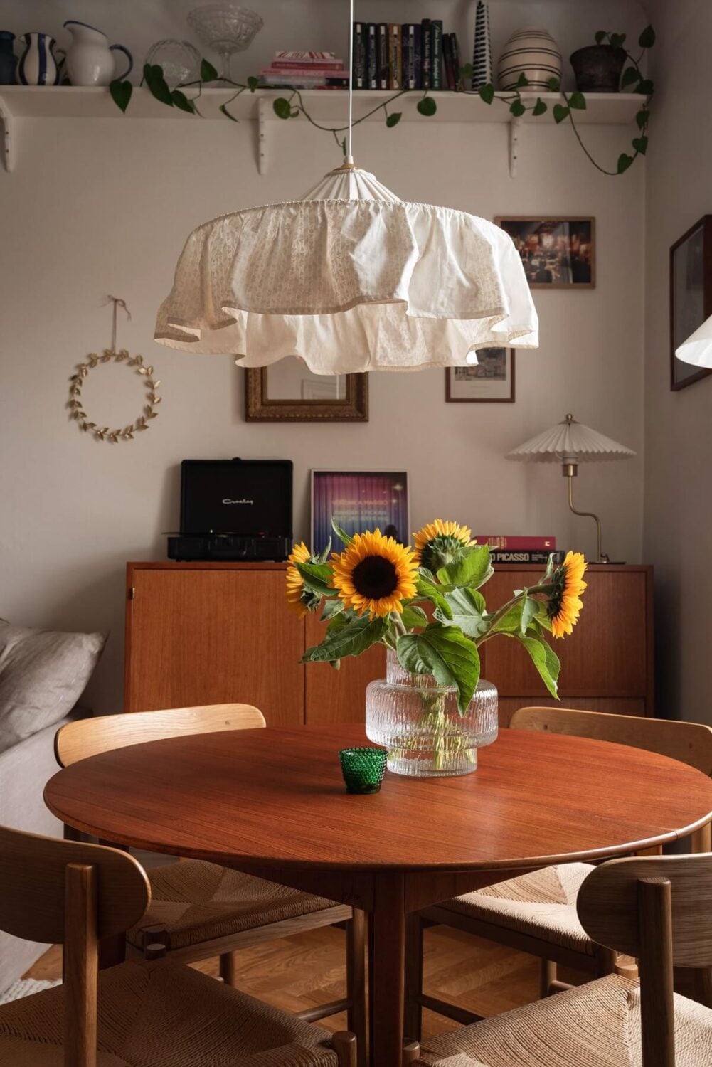 A Lovely Swedish Apartment with William Morris Bedroom 5 round-wooden-dining-table-high-shelf-nordroom