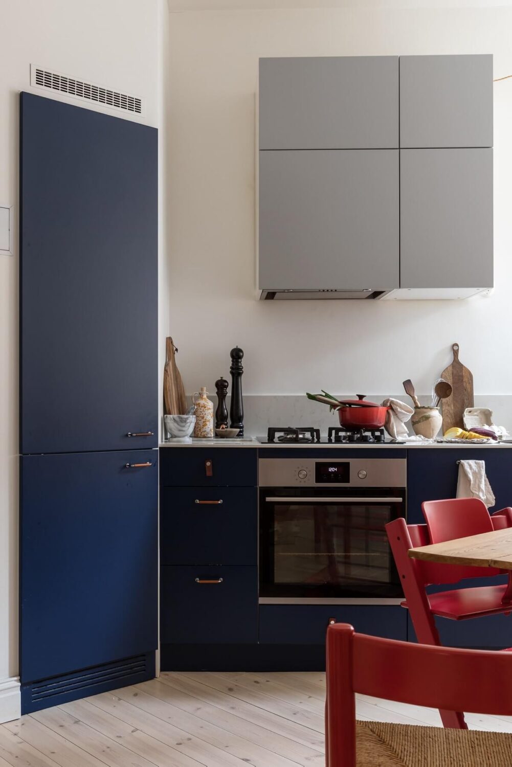 A Light Swedish Apartment with an Industrial Glass Wall 10 scandinavian-kitchen-blue-cabinets-nordroom
