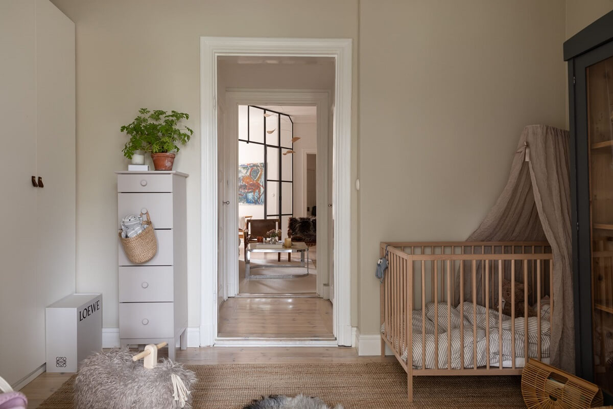 A Light Swedish Apartment with an Industrial Glass Wall 13 serene-nursery-built-in-wardrobes-nordroom