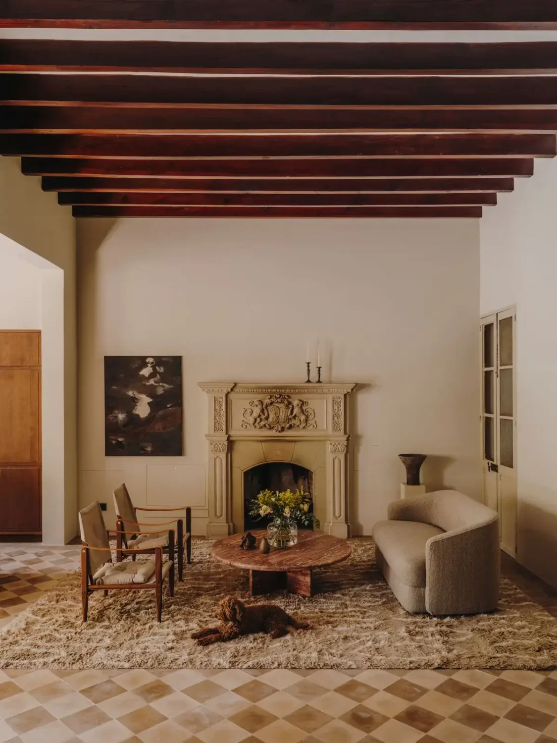 A Historic Townhouse on Majorca with a Striped Pool 6 sitting-room-original-floor-tiles-exposed-wooden-beams-nordroom