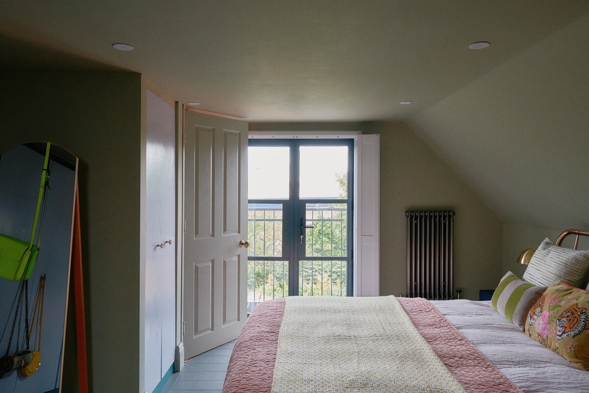 A Fun Colorful Family House in England 31 slanted-ceiling-bedroom