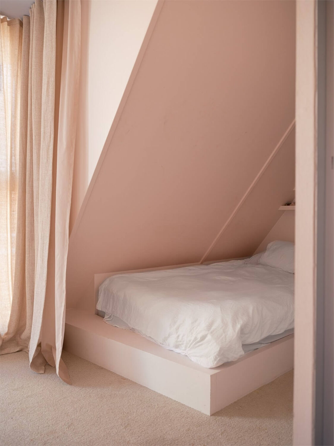 A Colorful Modern Townhouse in Malmö 14 small-light-pink-bedroom-slanted-ceiling-nordroom