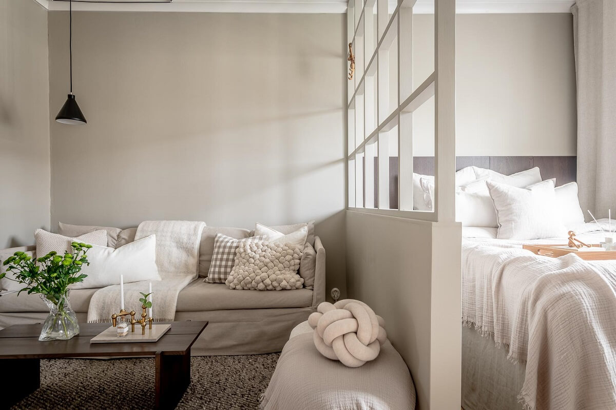 A Serene Studio Apartment with a Brown Kitchen 3 studio-apartment-room-divider-nordroom
