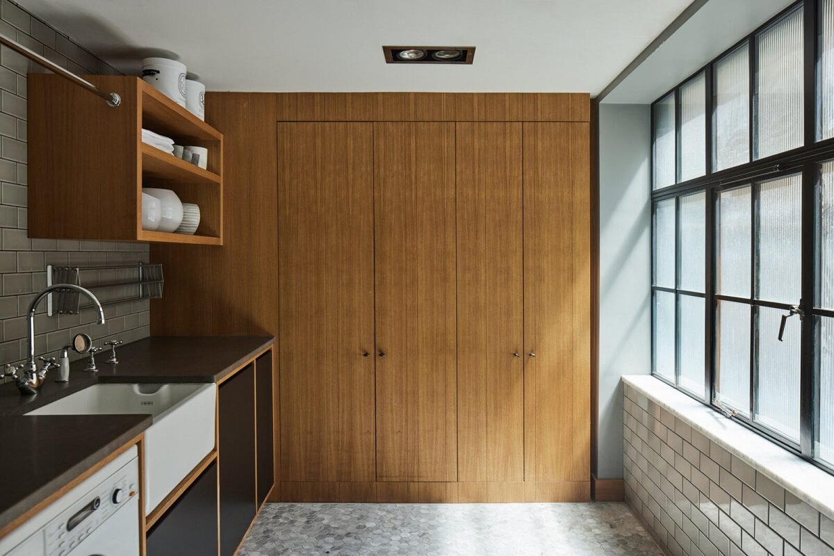 A Modern London Home with Custom Built Oak Furniture 9 utility-room-oak-built-in-cabinets-white-subway-tiles-nordroom